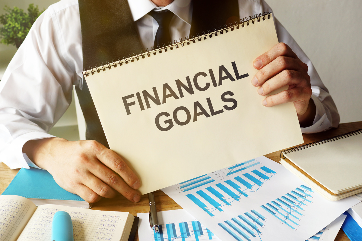 Business photo shows hand written text Financial Goals
